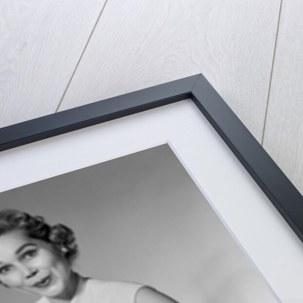 1950s woman looking at camera smiling holding platter of hors d'oeuvres snacks by Anonymous