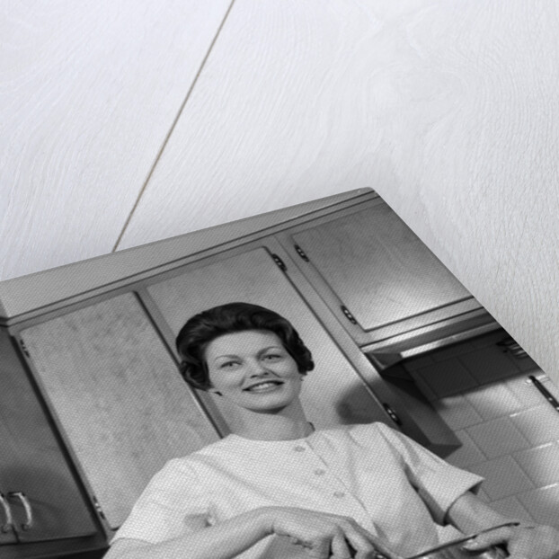 1960s woman kitchen housewife stir by Anonymous