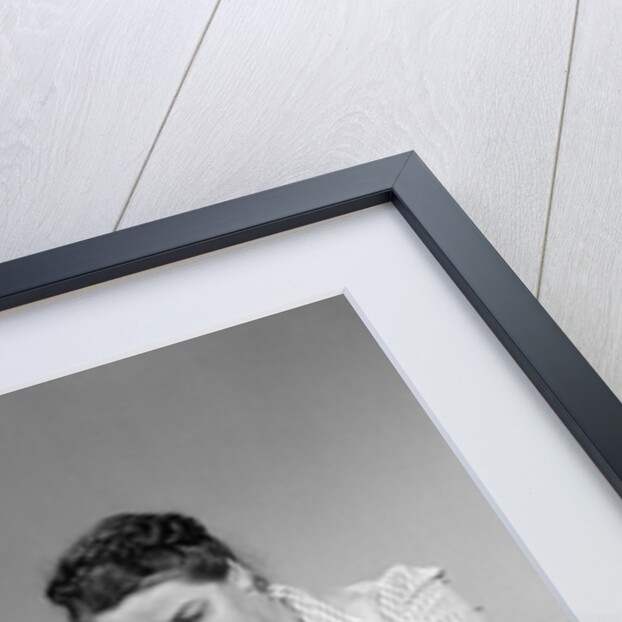 1940s mother son daughter in kitchen stuffing turkey for thanksgiving dinner by Anonymous