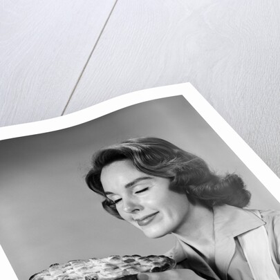 1950s 1960s woman smelling aroma of freshly baked pie by Anonymous