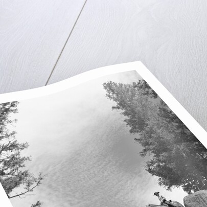 1950s 1960s two men on horseback riding across field wearing cowboy hats by Anonymous