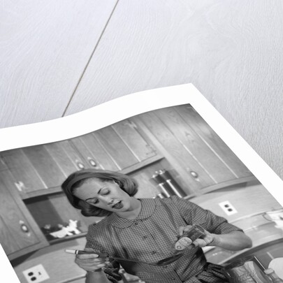 1960s woman baking in kitchen by Anonymous