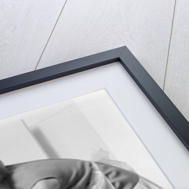 1970s woman removing laundry from dryer by Anonymous