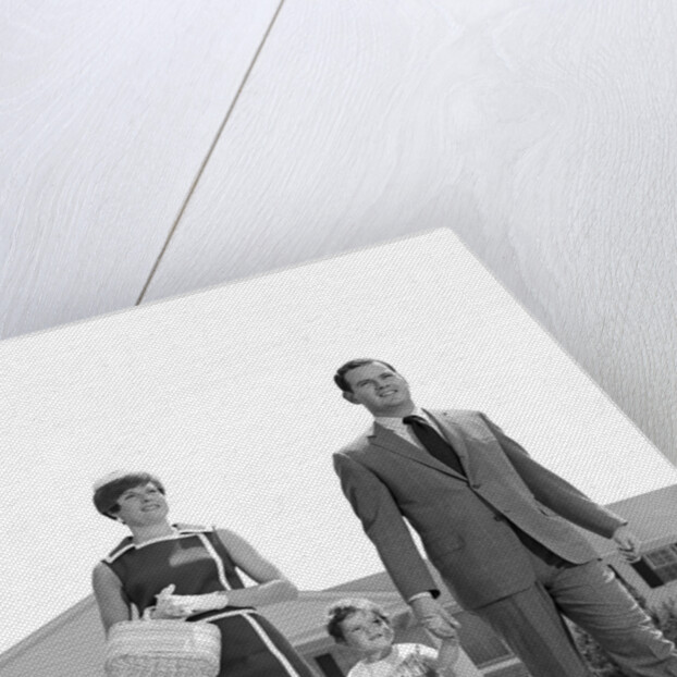 1960s 1970s family taking a walk sidewalk by Anonymous