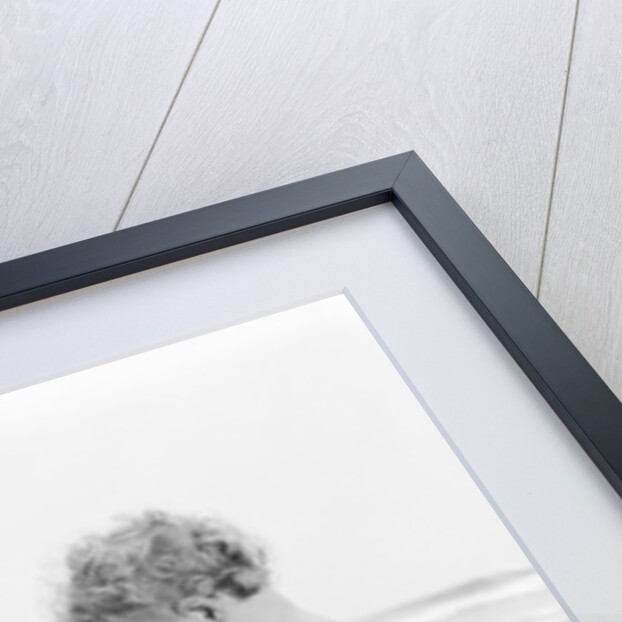 1960s 1970s child toddler standing in sand water bucket shovel by Anonymous