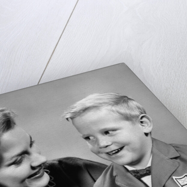 1960s portrait mother with arm around son dressed in school uniform with bow tie & emblem crest on jacket mom pearl lace collar by Anonymous