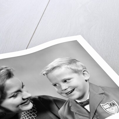 1960s portrait mother with arm around son dressed in school uniform with bow tie & emblem crest on jacket mom pearl lace collar by Anonymous