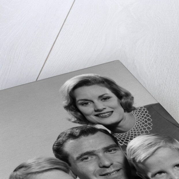 1960s family portrait father mother two sons smiling by Anonymous