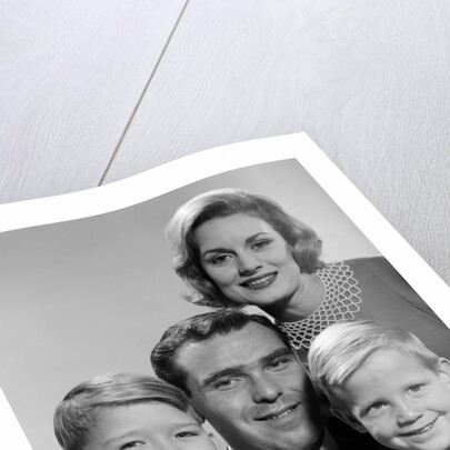 1960s family portrait father mother two sons smiling by Anonymous