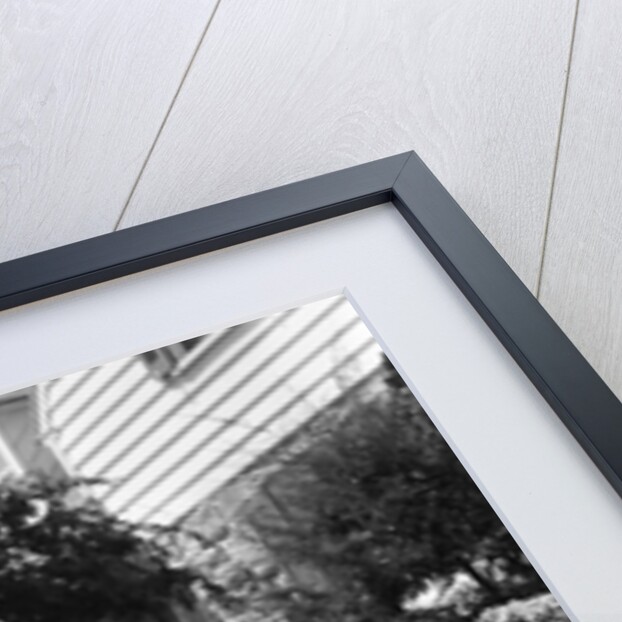 1950s two children holding hands smiling walking along sidewalk by Anonymous