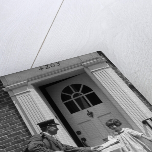 1920s smiling little girl receiving mail from postman by Anonymous