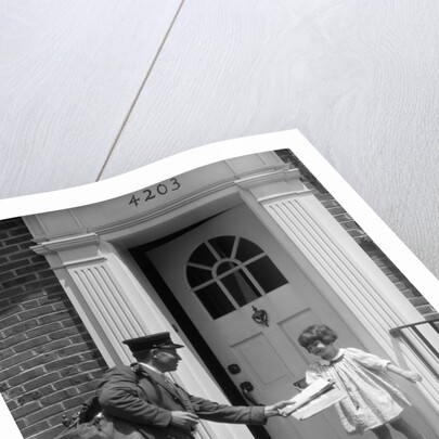 1920s smiling little girl receiving mail from postman by Anonymous