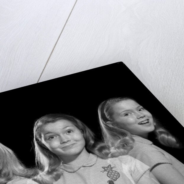 1950s 1960s multiple exposure girl going from happy to sad three facial expressions looking at camera by Anonymous