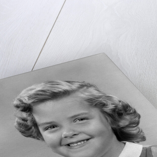 1950s portrait smiling girl with white collar plaid dress looking at camera by Anonymous