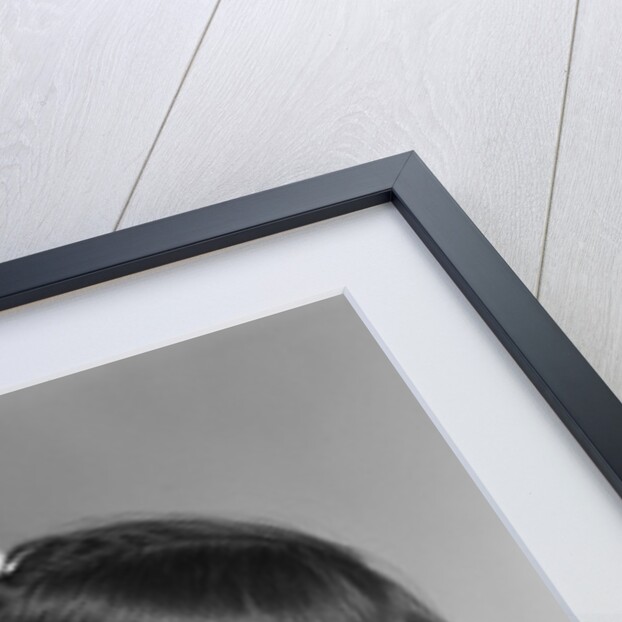 1950s smiling brunette girl with bangs by Anonymous
