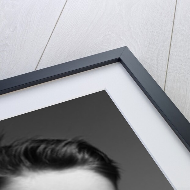 1950s child portrait boy with freckles posed resting head cheek on hand by Anonymous