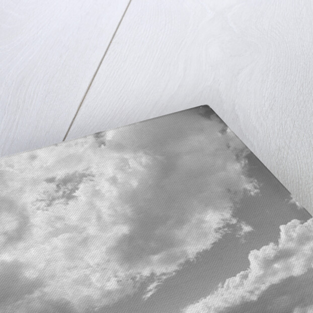 1950s 1960s family of four silhouetted on top rocky hill pointing at clouds in sky by Anonymous