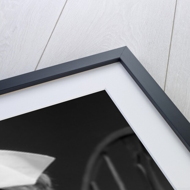 1930s little girl playing nurse with doll spoonful of medicine by Anonymous