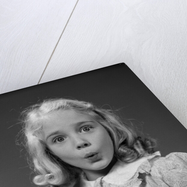 1940s 1950s blond girl whistling lips puckered eyes wide open looking at camera by Anonymous