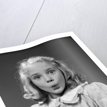 1940s 1950s blond girl whistling lips puckered eyes wide open looking at camera by Anonymous