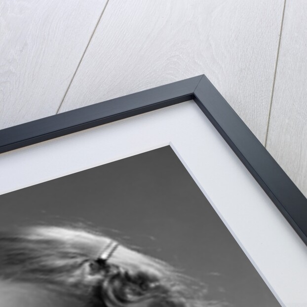 1950s little girl string tied on finger as reminder not to forget smiling looking at camera by Anonymous
