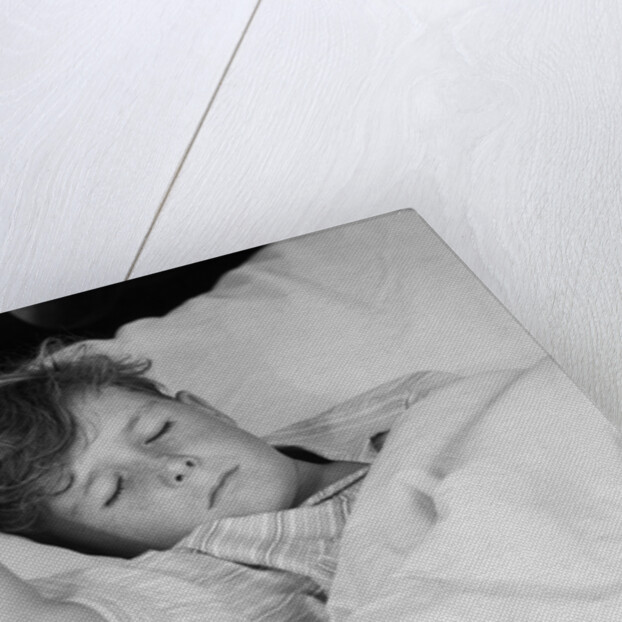 1940s 1950s boy sleeping in bed by Anonymous
