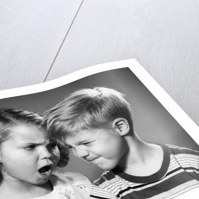 1950s boy and girl arguing head to head by Anonymous