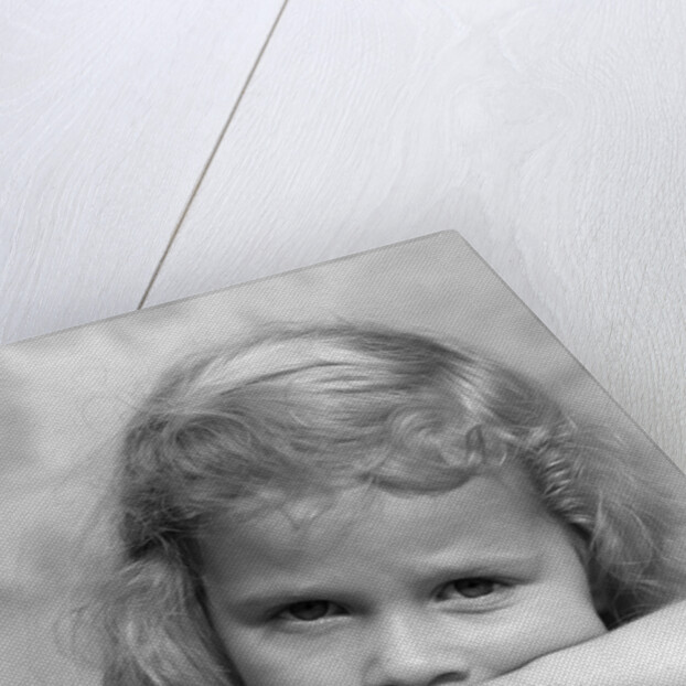1930s portrait sad little blond girl peeking over her hands looking at camera by Anonymous