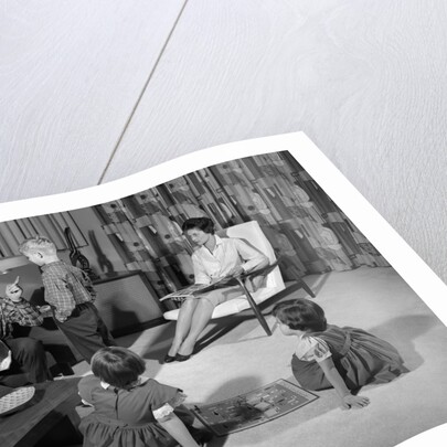 1960s family of four in living room boy is being disciplined by dad shaking finger by Anonymous