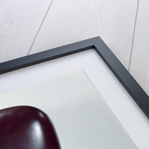 1960s chubby baby sitting in leather chair at office desk holding telephone by Anonymous
