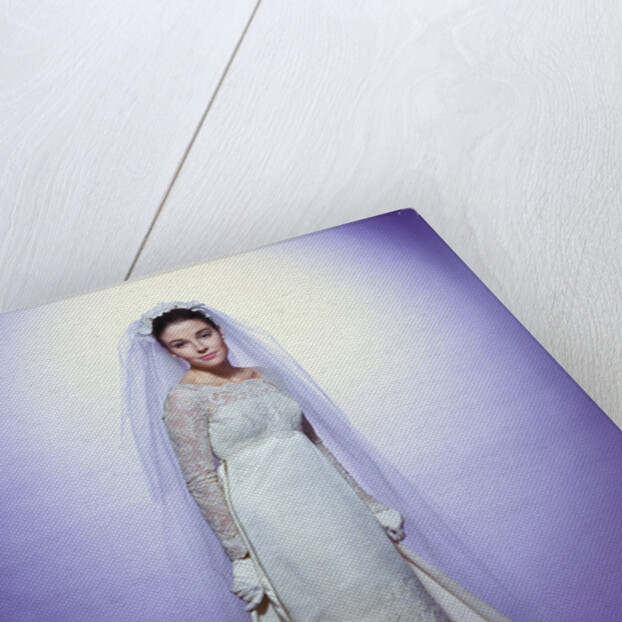 1960s young woman bride portrait bridal veil empire waist gown lace bodice hem full length by Anonymous