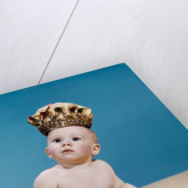 1960s baby wearing cloth diaper and crown holding a scepter by Anonymous