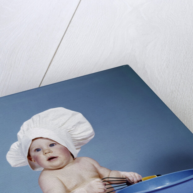 1950s 1960s baby wearing chef hat toque holding spatula blue mixing bowl by Anonymous