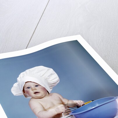 1950s 1960s baby wearing chef hat toque holding spatula blue mixing bowl by Anonymous