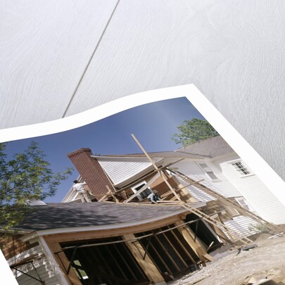 1960s 1970s workers building two car garage addition onto suburban home by Anonymous