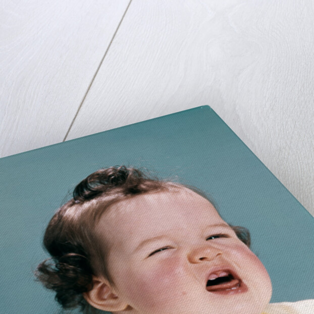 1950s 1960s unhappy crying baby mouth open showing new teeth teething pain by Anonymous