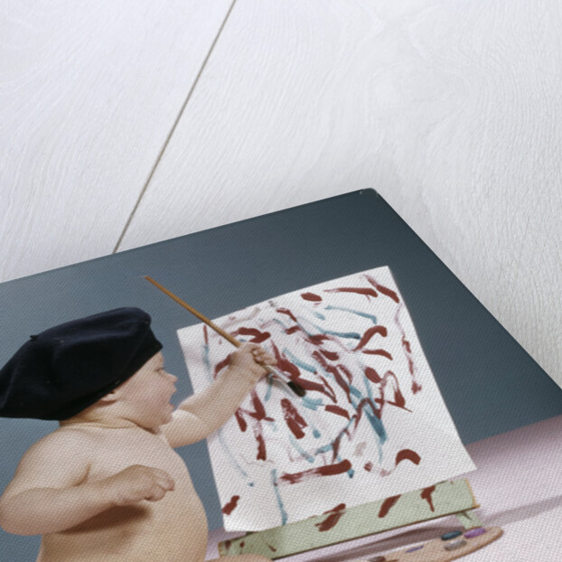 1960s baby artist wearing black beret sitting in front of easel painting by Anonymous