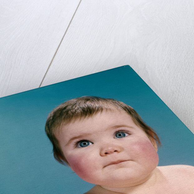 1960s portrait sweet brunette baby blue eyes looking up by Anonymous