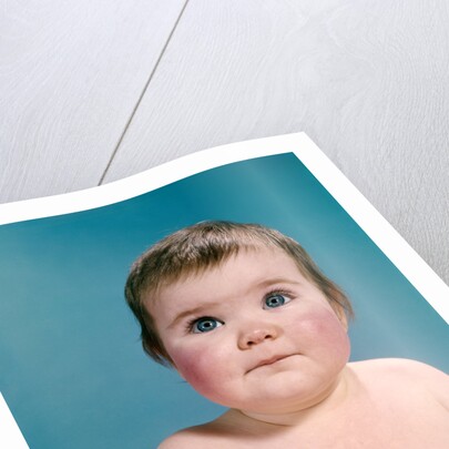 1960s portrait sweet brunette baby blue eyes looking up by Anonymous