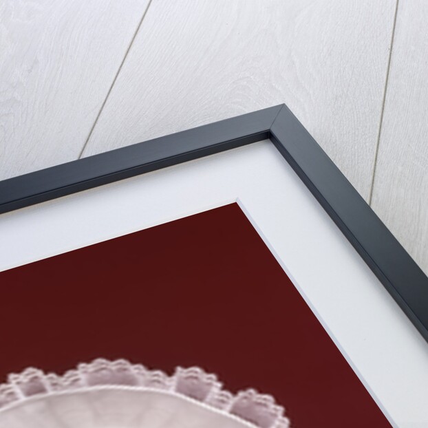1960s portrait baby girl wearing bonnet and blue gingham dress showing two front teeth looking at camera by Anonymous