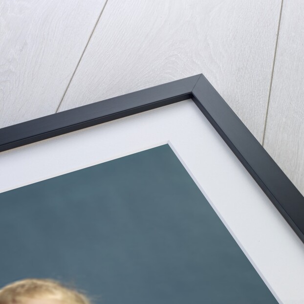 1960s baby holding telephone head set by Anonymous