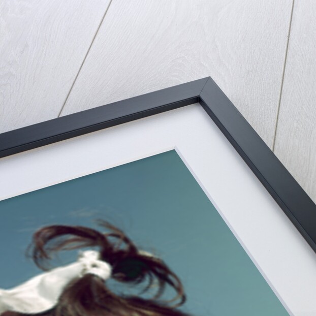 1960s brunette baby girl round chubby face yellow dress ribbon topknot interested sincere facial expression looking at camera by Anonymous