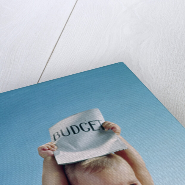 1960s baby holding budget sign above his head by Anonymous