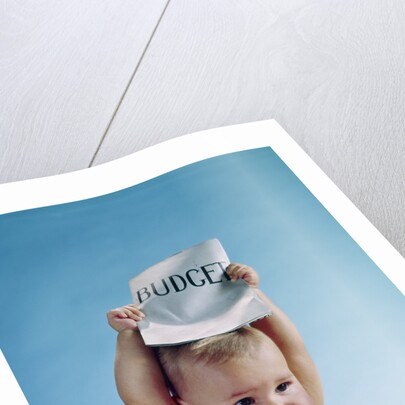 1960s baby holding budget sign above his head by Anonymous