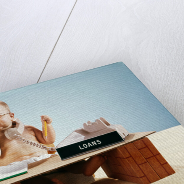 1960s baby businessman diaper sitting at loan desk wearing eyeglasses talking on telephone by Anonymous