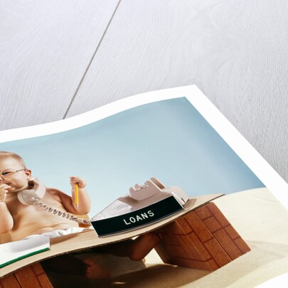 1960s baby businessman diaper sitting at loan desk wearing eyeglasses talking on telephone by Anonymous