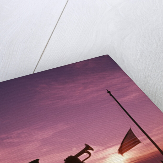 1960s boy scout blowing bugle as others raise american flag at camp sunset ceremony by Anonymous