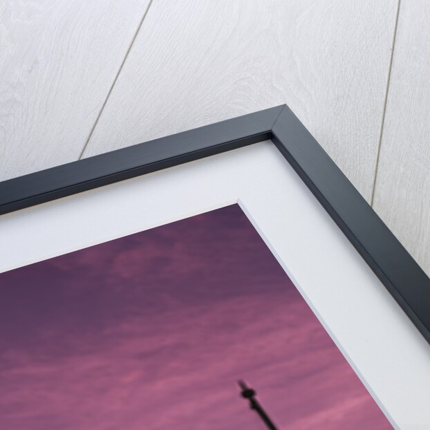 1960s boy scout blowing bugle as others raise american flag at camp sunset ceremony by Anonymous