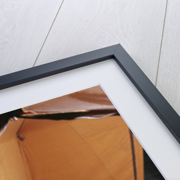 1960s father with lantern checking up on 3 boys in sleeping bags pajamas in tent by Anonymous