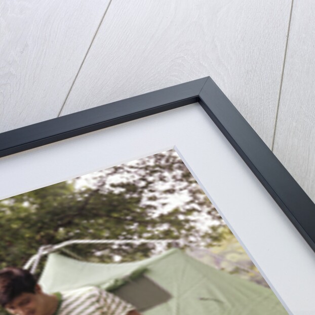 1960s three boys at campsite cooking camp stove eating food tent teens by Anonymous